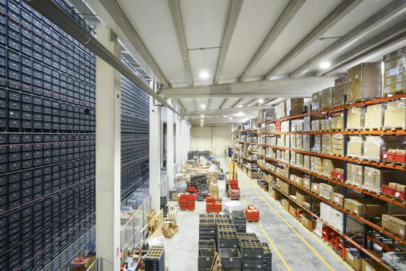 Large warehouse with tall shelves of boxes ready for shipping