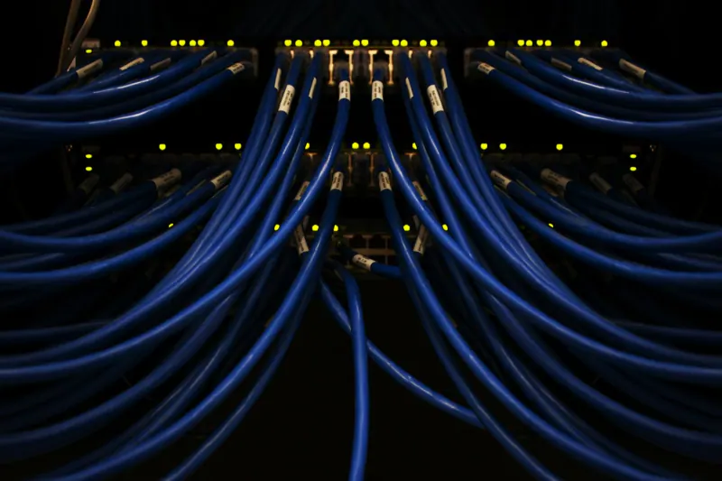 Blue network cables plugged into server equipment, as a metaphor for integrations