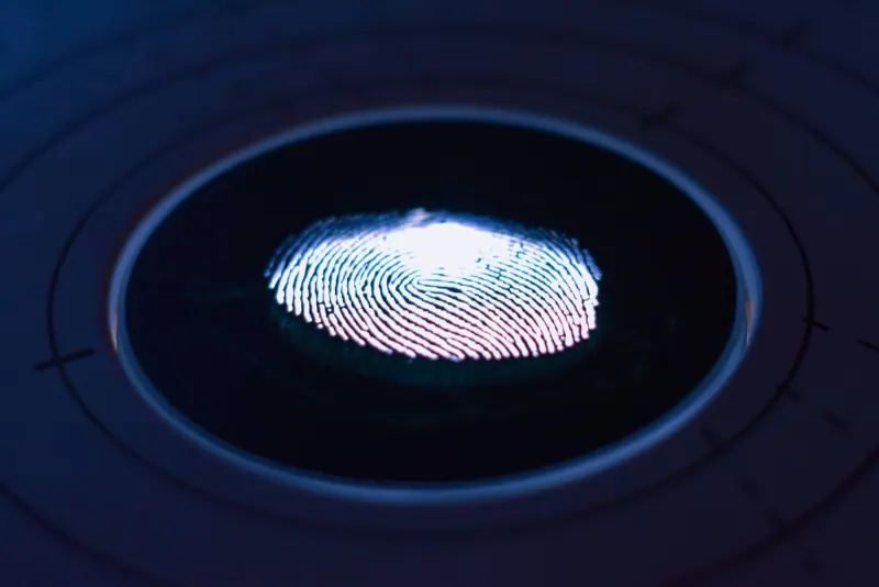 Illuminated fingerprint reader for logging staff attendance